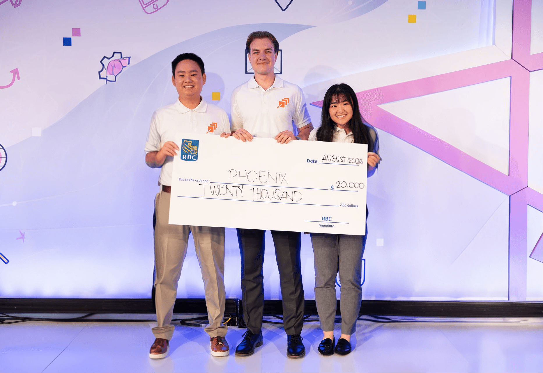 An image of my team at RBC, holding a check for $20,000, which we won for our project.